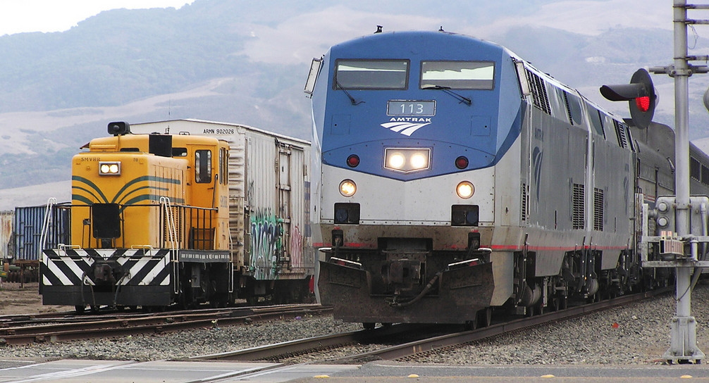 Amtrak and 70T frieght side by side at Guad